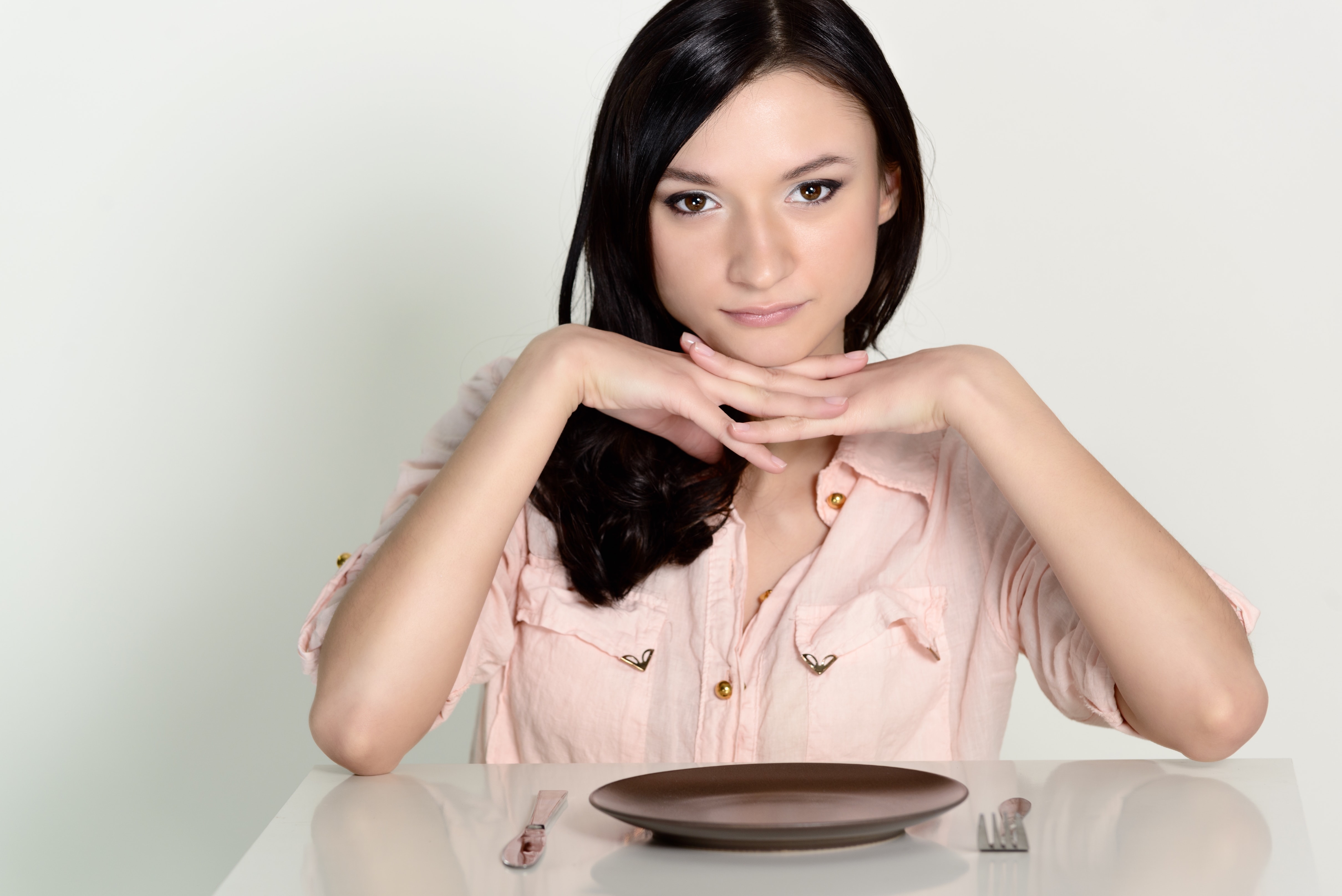 woman looking at empty plate