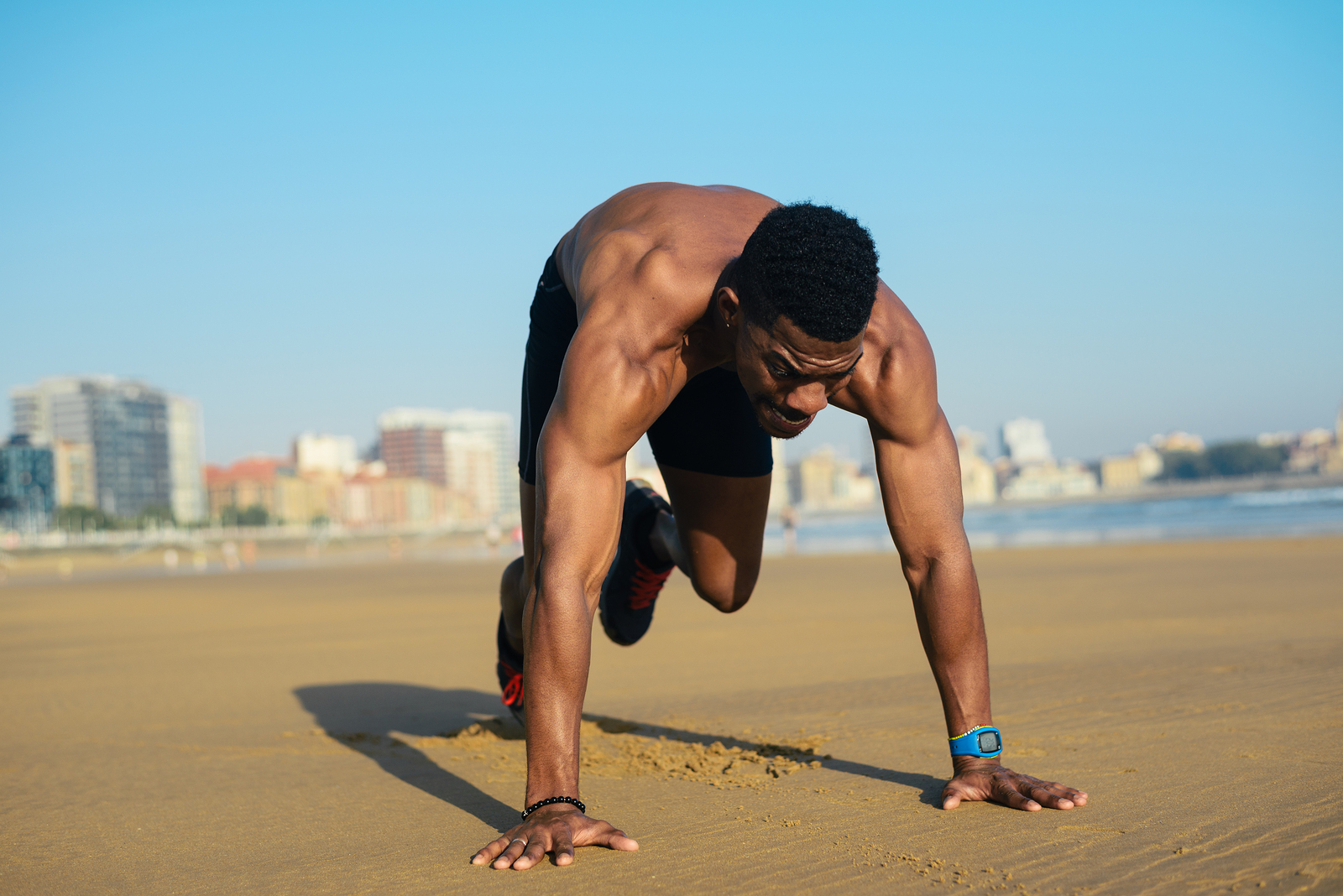 man doing mountain climbers as part of HIIT workout