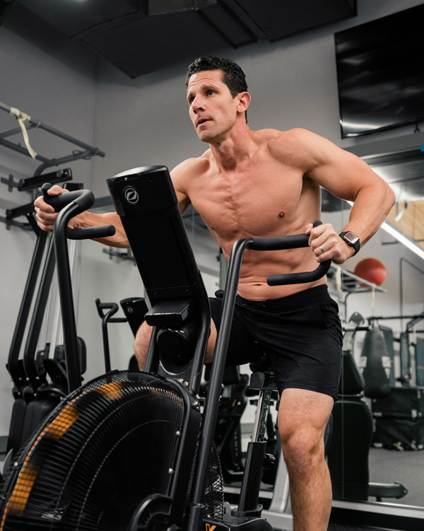 Ben Brown exercising on stationary bike